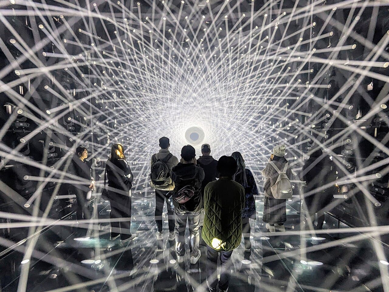 Visitors immersed in a light sculpture installation at teamLab Borderless digital art museum, Tokyo