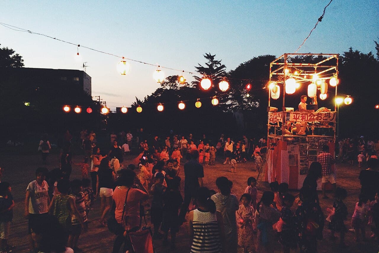 Bon Odori dancers at a Japanese summer festival in the evening