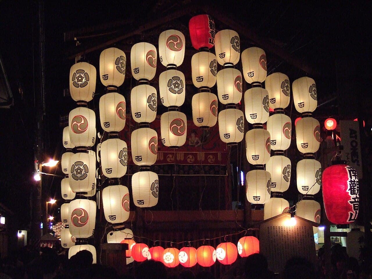 A festival float lit with paper lanterns during the Yoiyama evening of Kyoto's Gion Matsuri