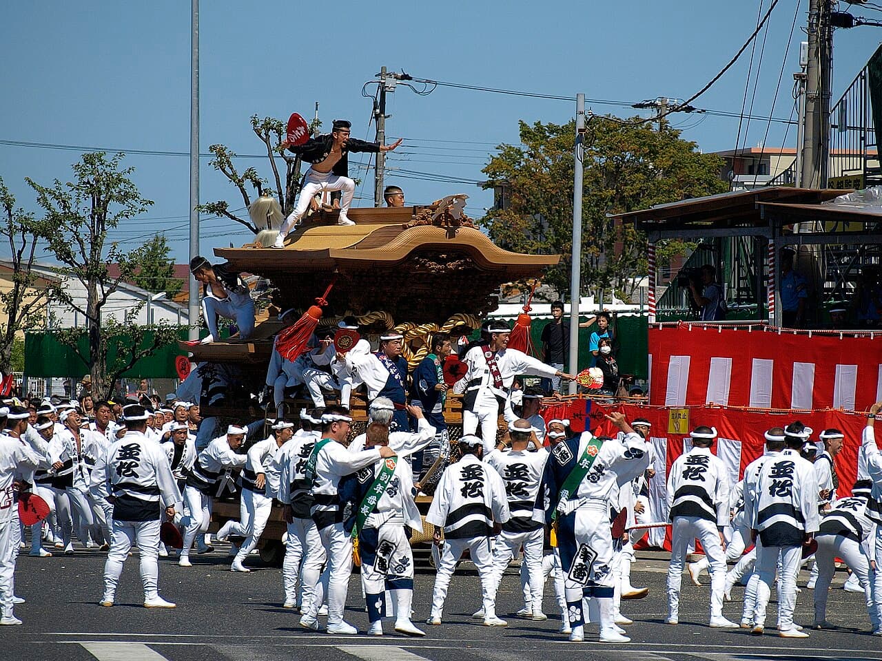 Participants pulling a wooden danjiri float at the Kishiwada Danjiri Matsuri in Osaka