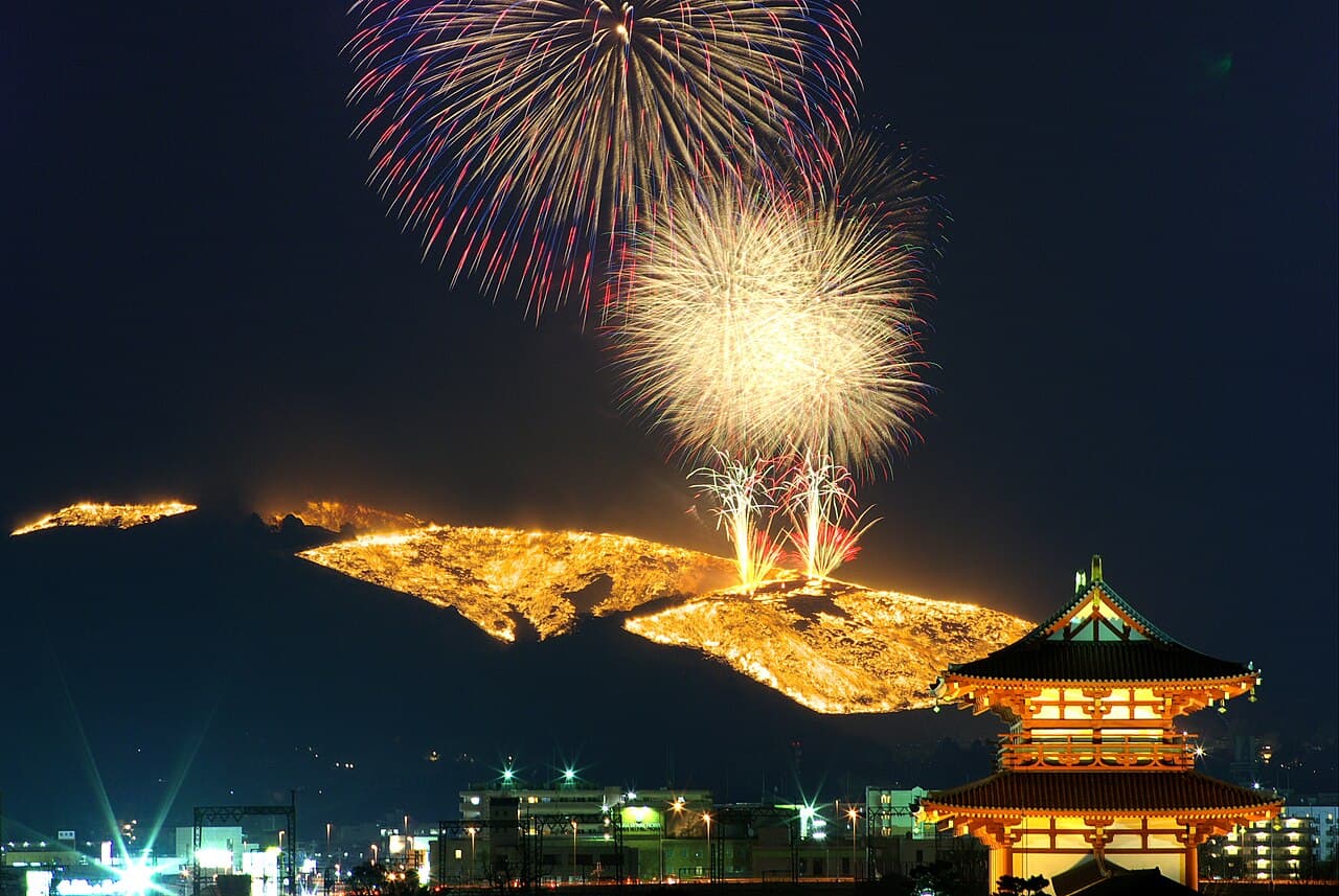 Fireworks and the burning hillside during the Wakakusa Yamayaki in Nara