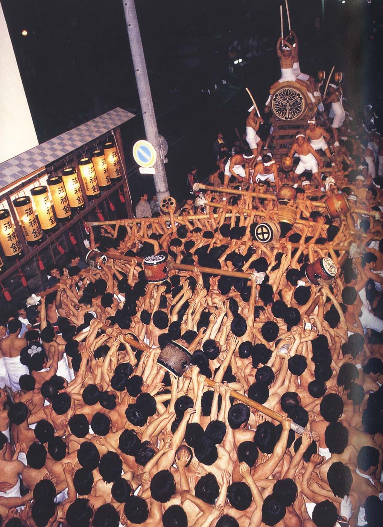 The Okoshi-daiko drum tower carried by men at night during the Hida Furukawa Festival