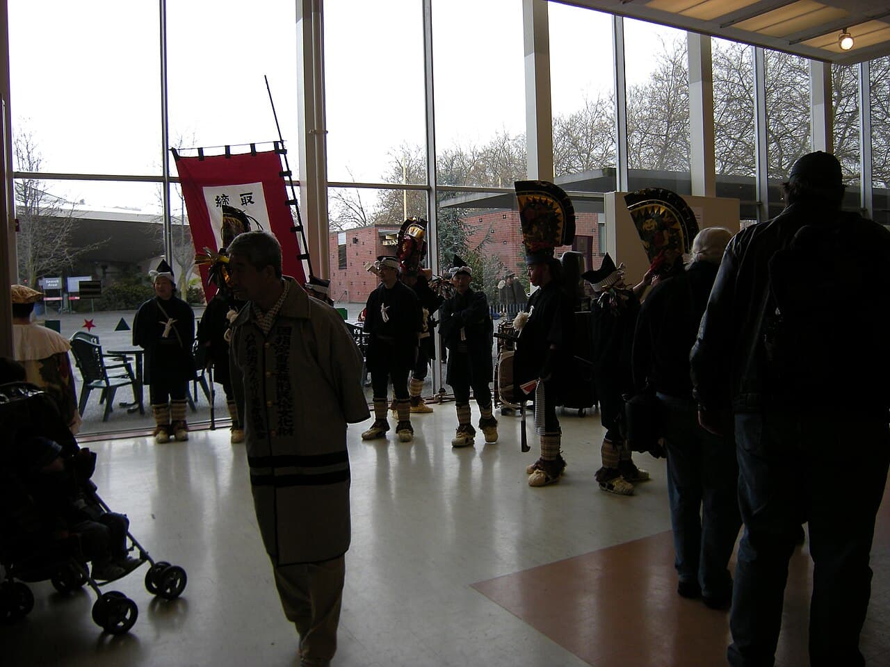 Enburi dancers of the Hachinohe Enburi Preservation Society in tall black horse-head eboshi headdresses, pictured during a 2008 overseas tour to Seattle