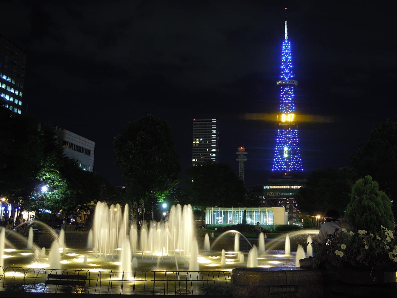 Sapporo TV Tower illuminated at night above Odori Park