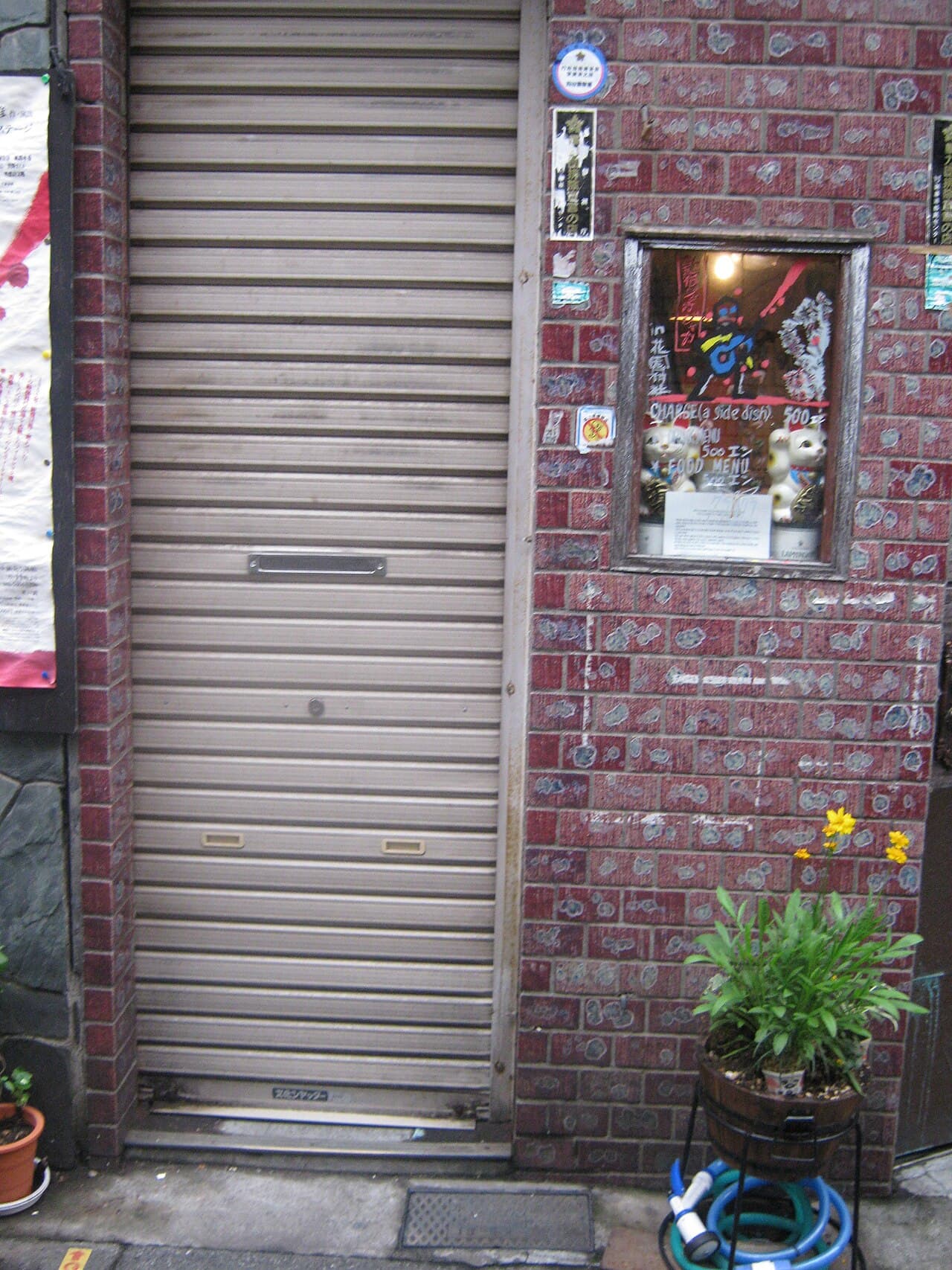 Narrow alley lined with tiny bars in Shinjuku Golden Gai, Tokyo