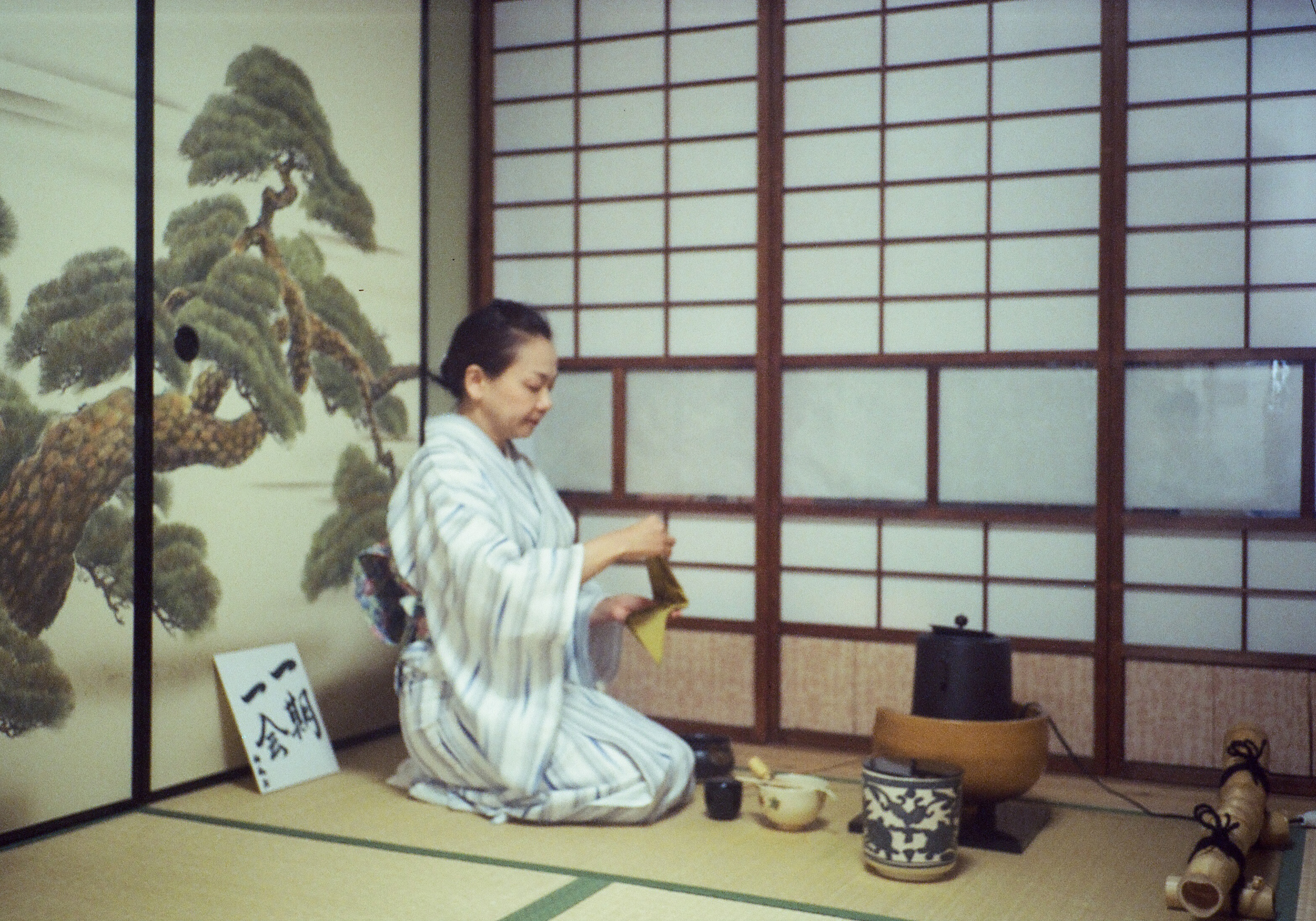 Host preparing matcha during a Japanese tea ceremony in Kyoto