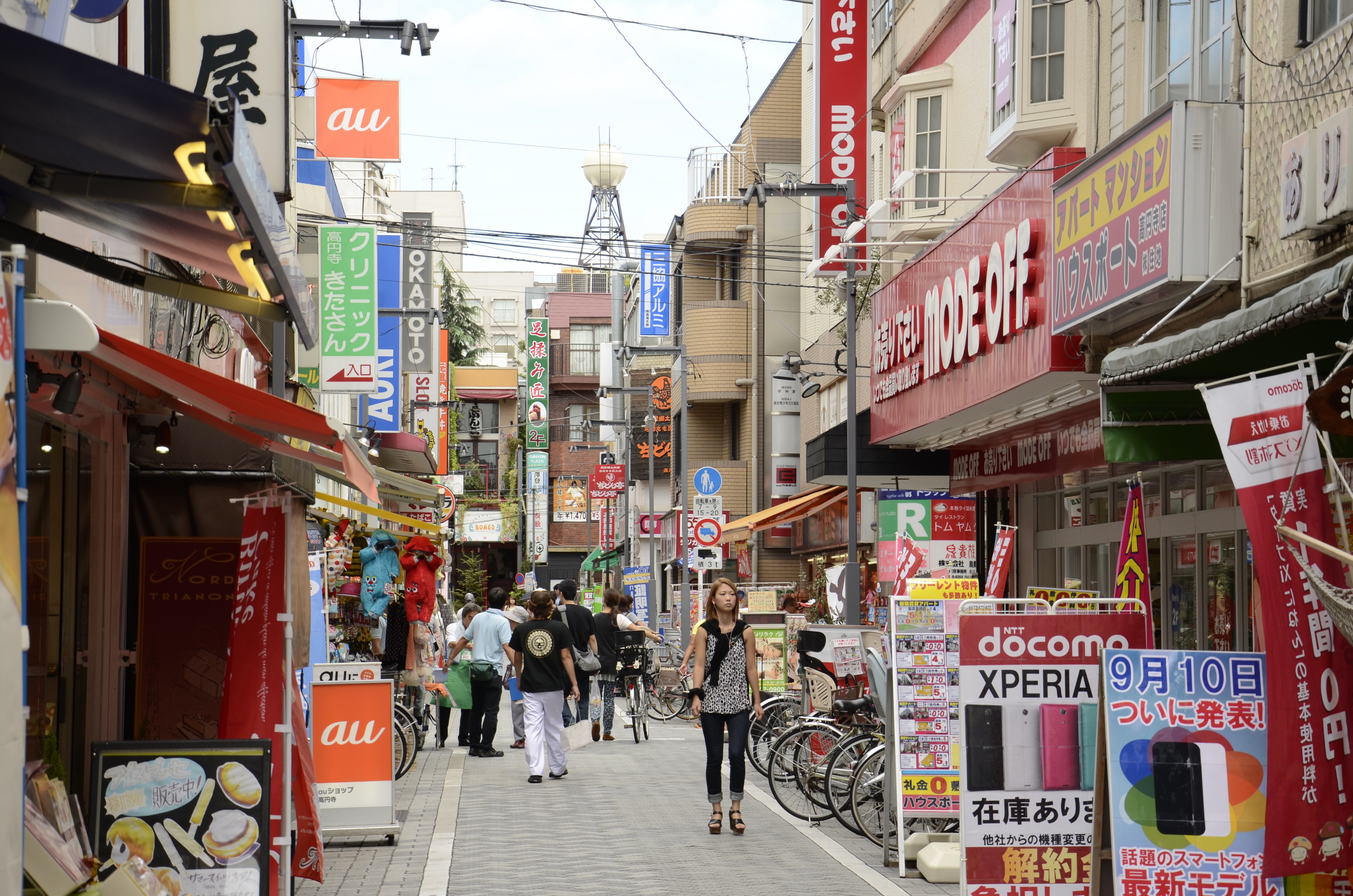 A narrow, densely packed shopping street in the Shimokitazawa district of Tokyo