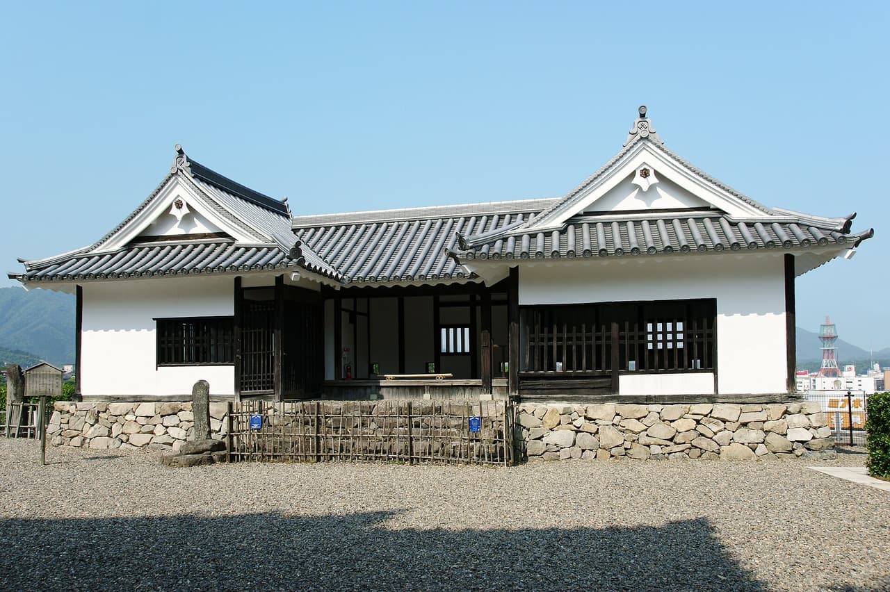 The keep of Fukuchiyama Castle in Kyoto Prefecture above its undressed stone walls